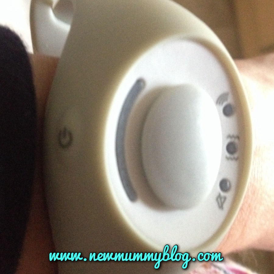 The button on the left turns on the Babble Band baby monitor watch