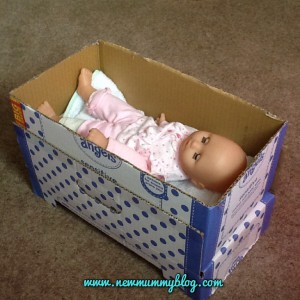Make a doll's bed from a cardboard box