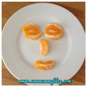 a face made from orange segments