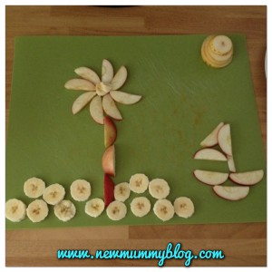 palm tree, beach and boat made from apples, pears, bananas