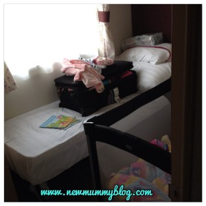 Fitting a travel cot into a caravan bedroom
