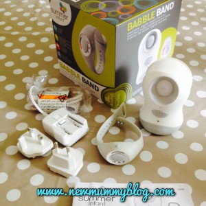 the contents of the babble band box, charger, european plug, base unit, watch receiver, box and instructions