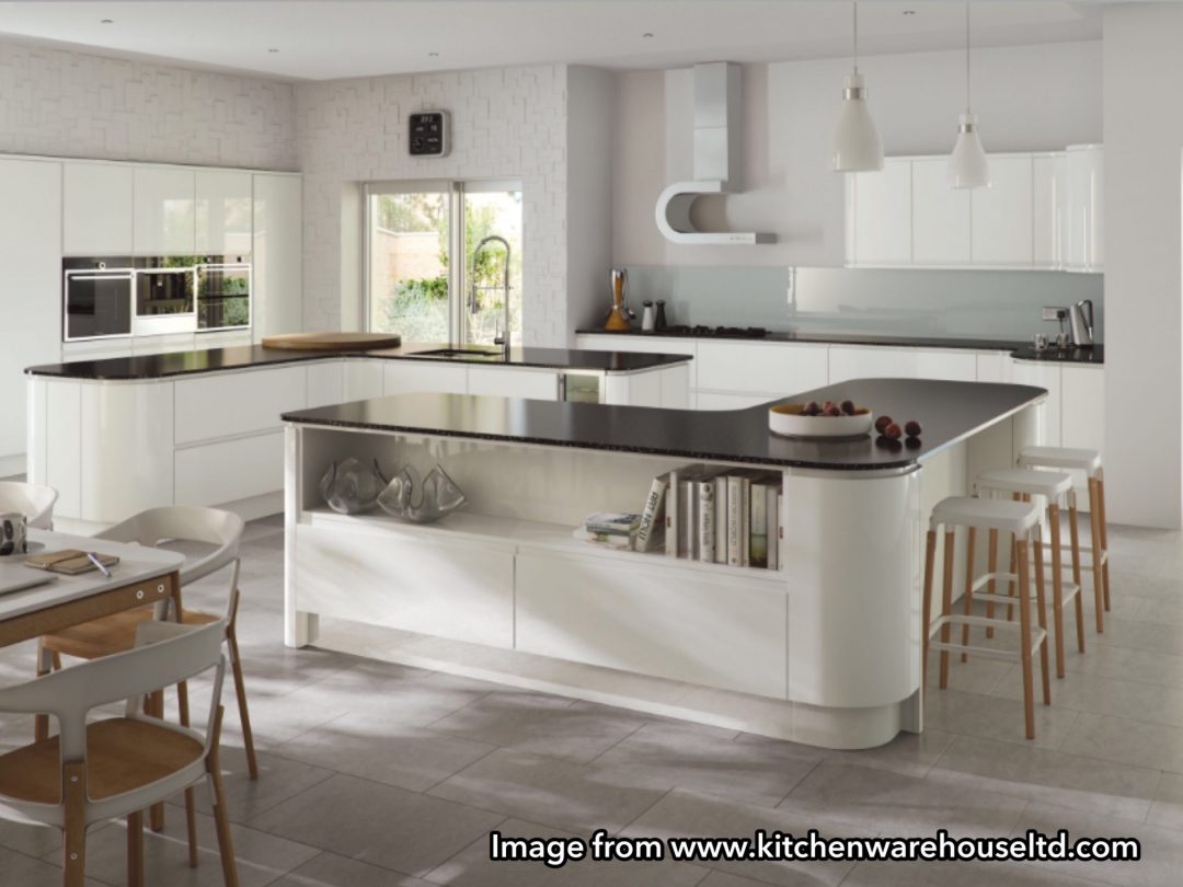 Image from Kitchen Warehouse Ltd glossy handleless kitchen 