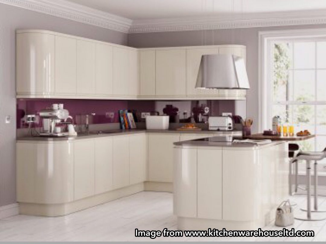 Image from Kitchen Warehouse Ltd glossy handleless kitchen 